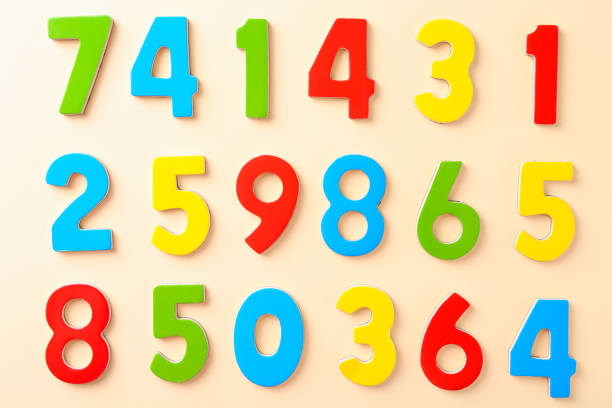 istock Colorful numbers on beige background, flat lay 2204287793