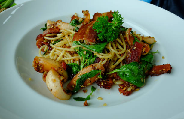 istock Spaghetti stir-fried with bacon and dried chili 2204287989