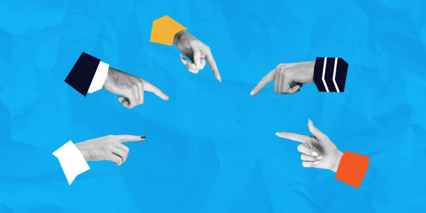 istock Conceptual illustration of hands pointing in different directions on blue background. 2204288454