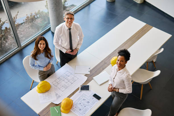 istock Architects smiling at camera during a meeting in the office 2204288483
