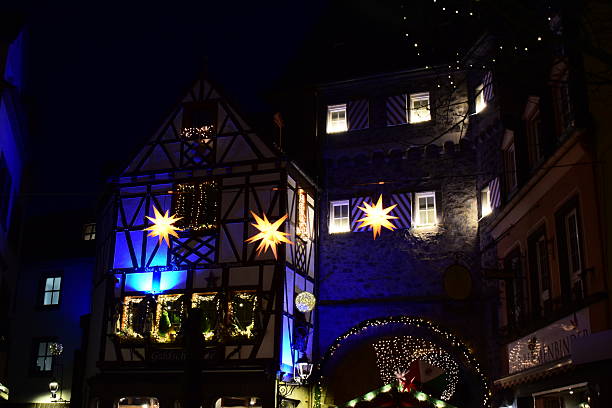 Mayen, Germany - 12/20/2024: city walls gate win blue and golden lights, Brückentor