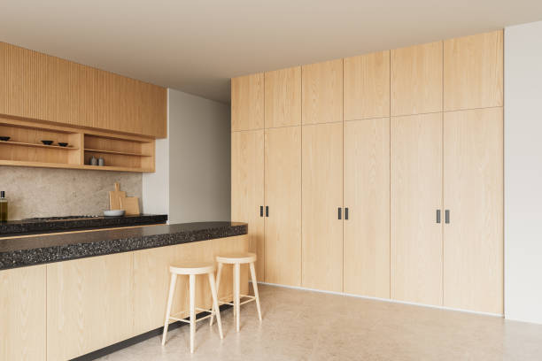istock Modern kitchen interior with light wood cabinets and dark stone countertop. 3D Rendering 2204288779