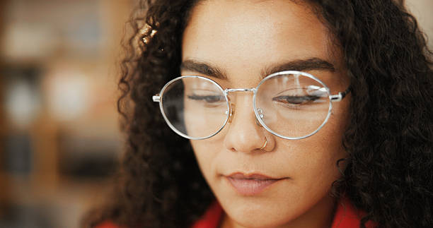 istock Closeup, woman and thinking with glasses in home for article proofreading, creative project research or ideas. Freelancer, copywriting and person with focus on blog inspiration and planning process 2204289282