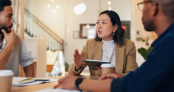istock Woman, men and discussion with tablet for planning event, wedding or ceremony with budget, notes and app. People, meeting and leader with touchscreen for party, gala and project management at startup 2204289590