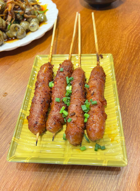istock Grilled skewered sausages with mala sauce 2204289900