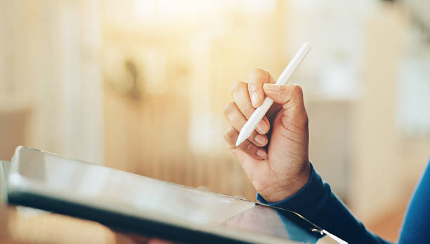 istock Hands, tablet and writing with stylus in office for interior design with review for project management. Person, drawing and digital touchscreen with application, editing and creativity at startup 2204290959