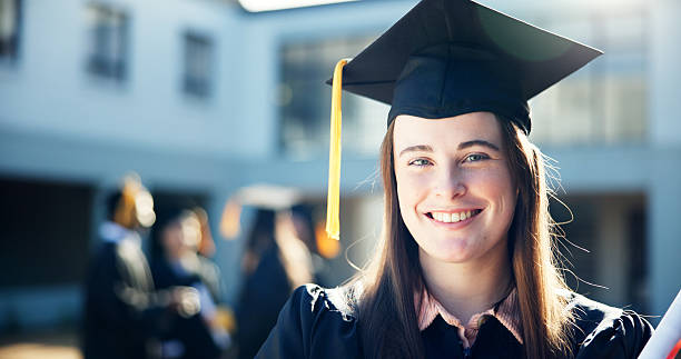 istock Graduation, student and woman with certificate, knowledge and achievement for people with scholarship. Portrait, excited and pupil with degree for education, success and completion of university 2204291444