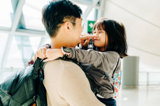 istock Father and child sharing a heartwarming moment before their journey 2204292365