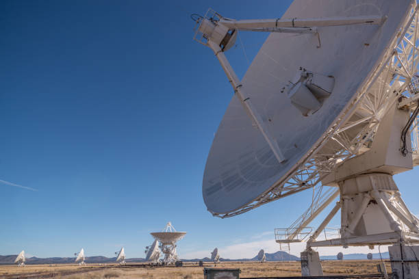 istock Radio telescopes with large white dish antennas 2204293814