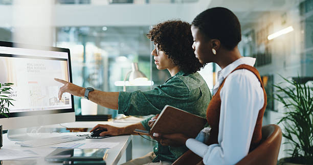 istock Office, teamwork and business people with screen for computer, reading article and journalists. Collaboration, employees and editor with digital for creative agency, magazine layout and planning 2204297251