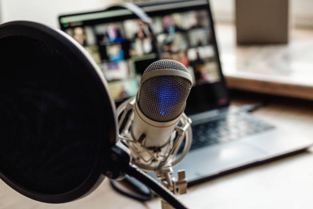 istock Radio broadcasting studio with podcast equipment: microphone and laptop 2204300596