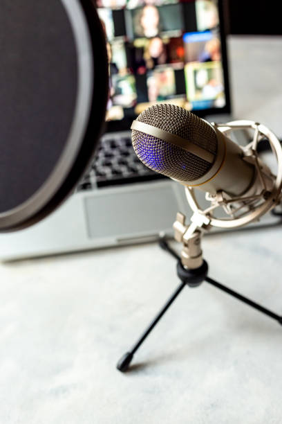 istock Home studio for podcast recording. Microphone and laptop on table 2204300705
