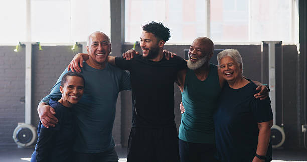 istock Mature people, personal trainer and group in gym class for exercise, workout or training. Physical therapy, support and help with portrait for fitness, coach and wellness for retirement health 2204301388