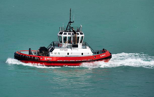 Christchurch, New Zealand – December 22, 2024: A red tugboat named Te Mata navigating turquoise waters in Napier harbor