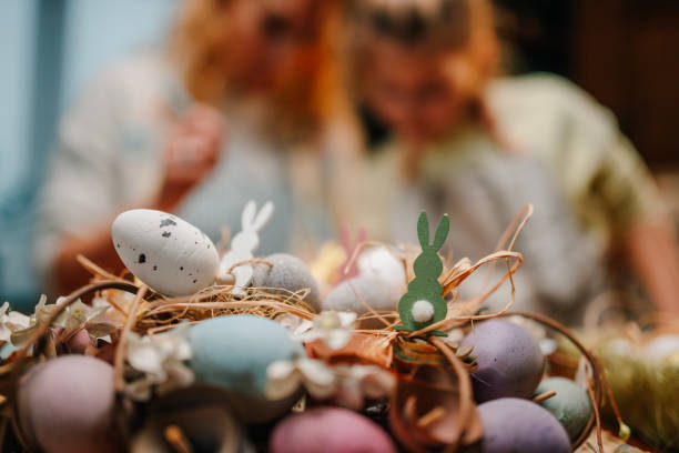 istock Easter eggs nest with bunnies celebrating spring holidays 2204306532