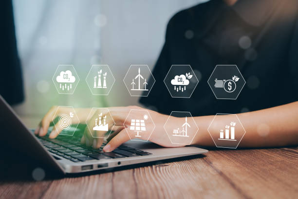 istock Business Professional Analyzing Sustainability Icons on Laptop Keyboard in Modern Workspace, Business concept 2204310178