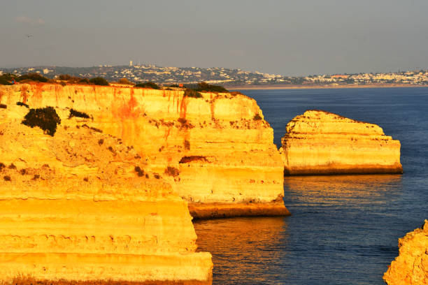 walking path with breathtaking views through the coast from porches to benagil caves lagoa algarve portugal