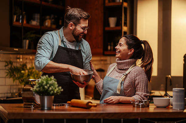 istock Couple enjoying cooking together in modern kitchen 2204312825