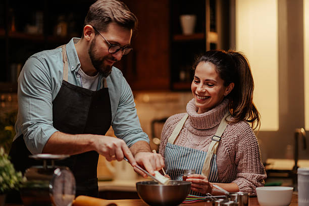 istock Couple enjoying cooking together in modern kitchen 2204312855