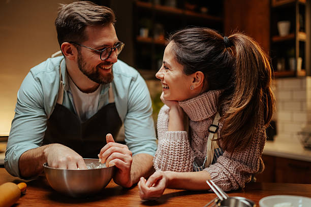 istock Couple enjoying baking together in cozy kitchen 2204312863