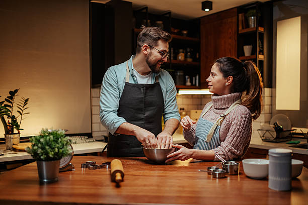 istock Couple enjoying baking together in cozy kitchen 2204312880