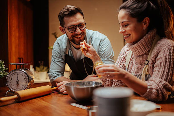 istock Couple enjoying baking together in cozy kitchen 2204312884