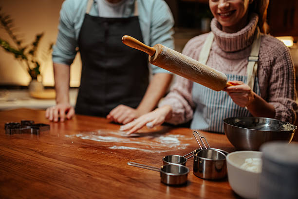 istock Couple enjoying baking together in cozy kitchen 2204312886