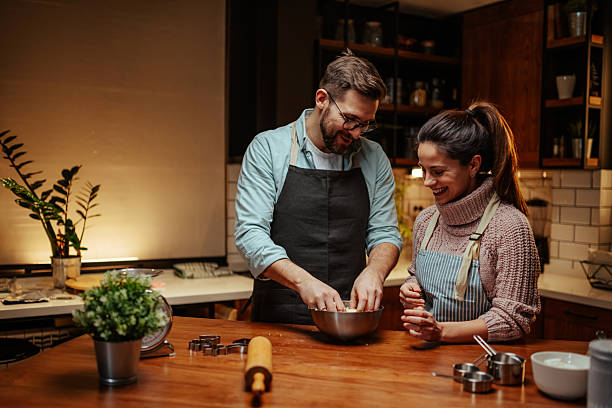 istock Couple enjoying baking together in cozy kitchen 2204312887
