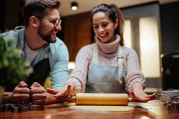 istock Couple enjoying baking together in cozy kitchen 2204312890