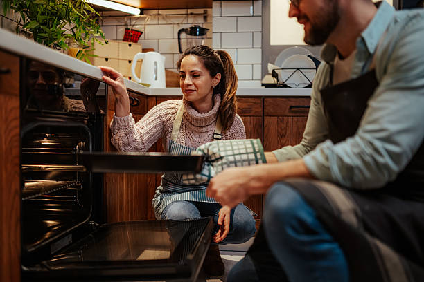 istock Home baking team preparing delicious meal together 2204312909
