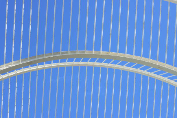 An intricate wooden abstract design showcasing modern architecture against a clear blue sky. Background for graphic resources.