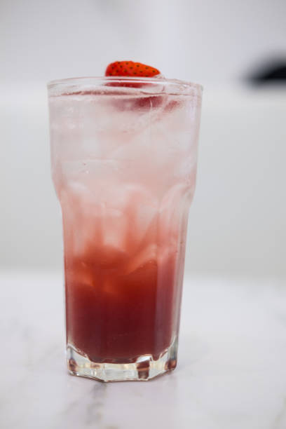 istock Fresh summer cocktail with strawberry mix with ice cubes and soda. 2204315295