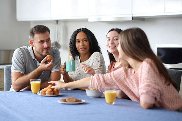 istock Interracial friends at breakfast talking at home 2204317252