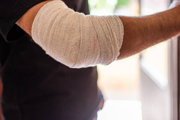 little child boy with plaster bandage on leg