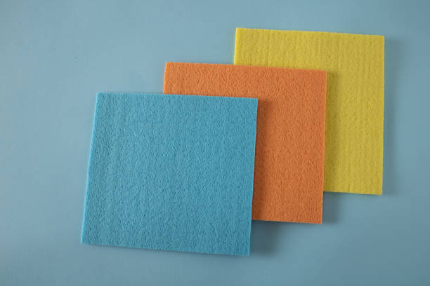 istock Blue, orange and yellow cloth on a blue shelf in a store waiting for a customer 2204318151