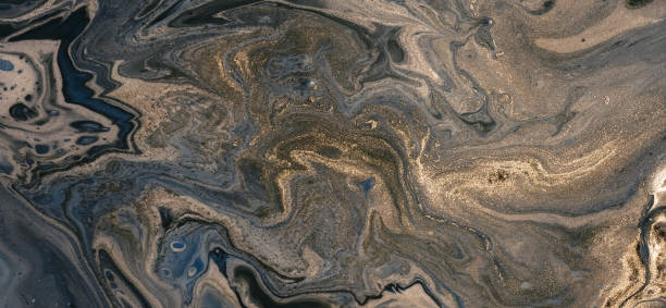 istock Abstract acrylic fluid texture in blue tones and golden splashes 2204318183
