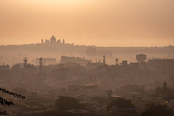 istock Crowded Cityscape with Palace and Sunrise Mist 2204321128