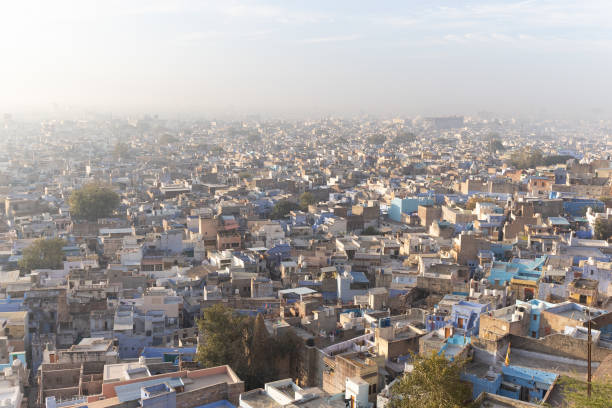 istock crowded blue city view from mountain top at morning 2204321130