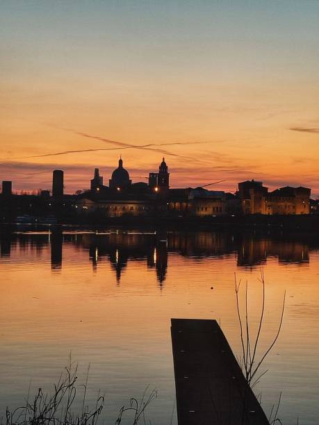Silouette of Mantua at sunset from inferior lake shore