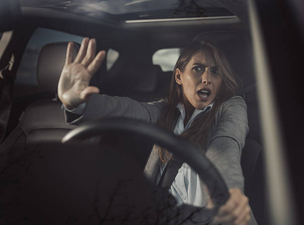 istock Shocked woman sitting in car 2204325789