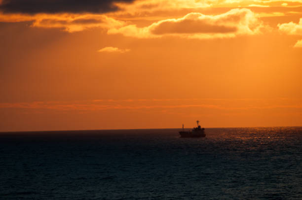 Beautiful sea dusk with a ship silhouette