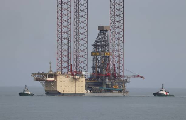 Jack-up oil rig Noble Intrepid being pulled into Aberdeen South Harbour, Scotland on Monday 3rd March 2025