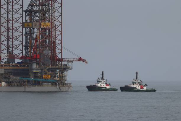 Jack-up oil rig Noble Intrepid being pulled into Aberdeen South Harbour, Scotland on Monday 3rd March 2025