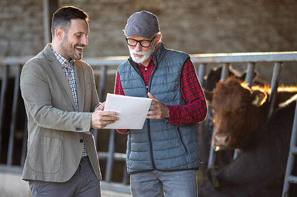 istock Farmer and businessman talking about contract 2204329525