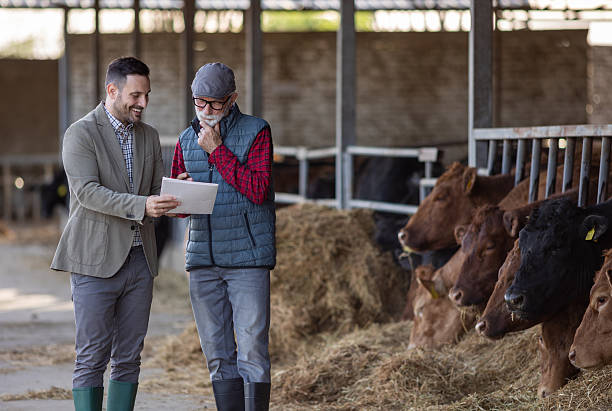 istock Farmer and businessman talking about contract 2204329529