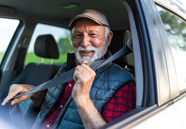 istock Man fastening seat belt in car before starting 2204332759