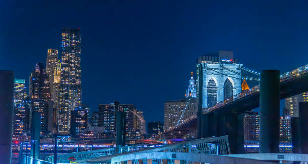 istock Brooklyn bridge and Manhattan skyline on the background at night 2204335796