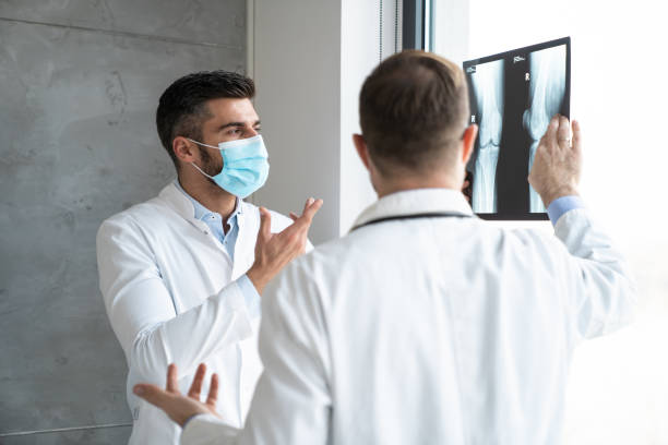 istock Working Together – Doctors Reviewing X-Ray 2204337589