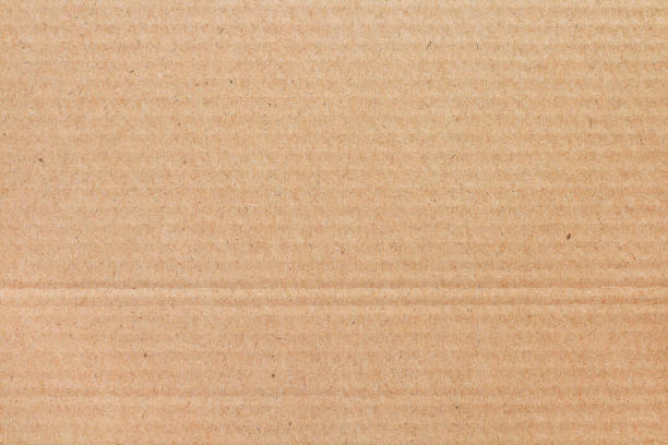 istock Cardboard sheet texture background, detail of recycle brown paper box pattern. 2204339422