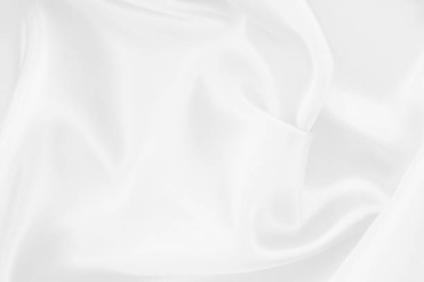 istock White fabric texture background, detail of silk or linen pattern. 2204339456